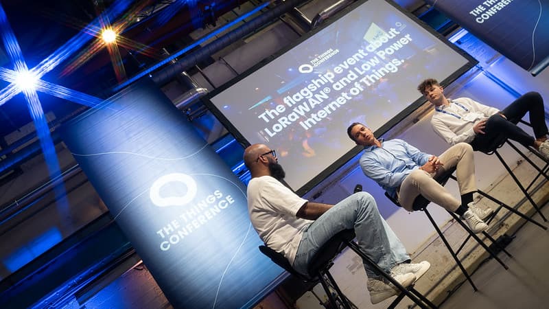 Speakers discussing IoT on stage at a previous conference